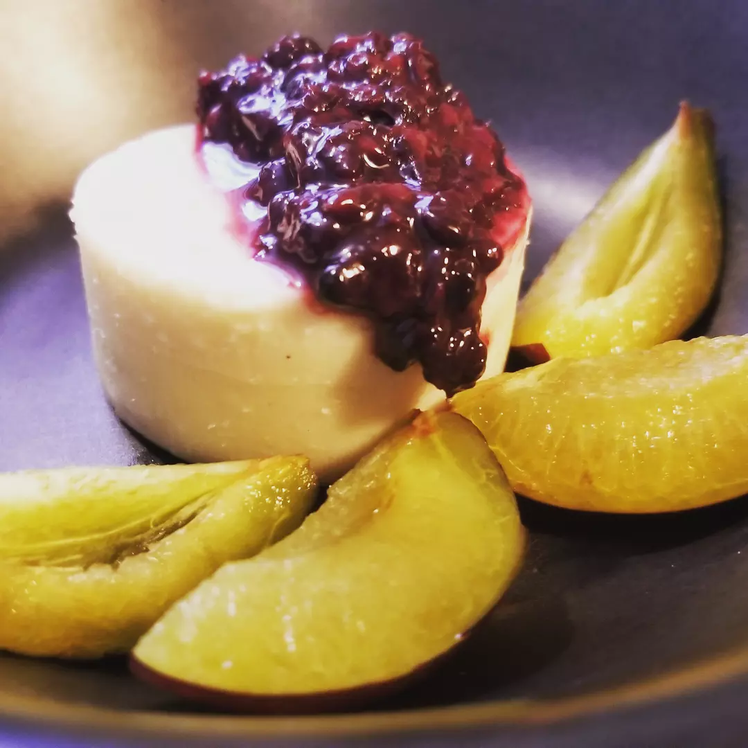 White bean, cacao butter and coconut dessert with salal and oregon grape compote